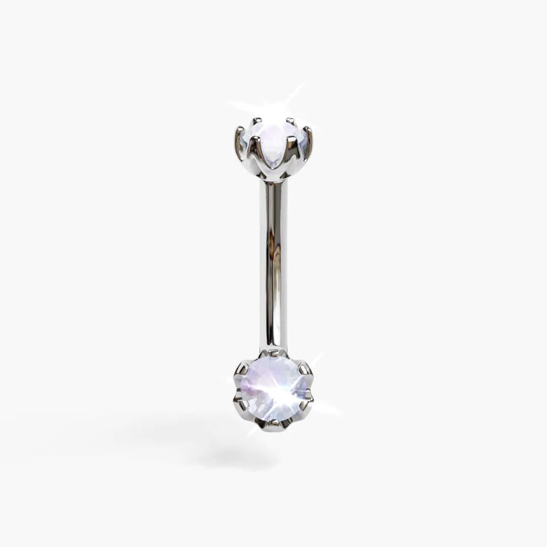 Jolie Co Orchid 4mm Moonstone dainty belly ring in white gold: a milky 4mm round moonstone in orchid-petal prongs below a 4mm top