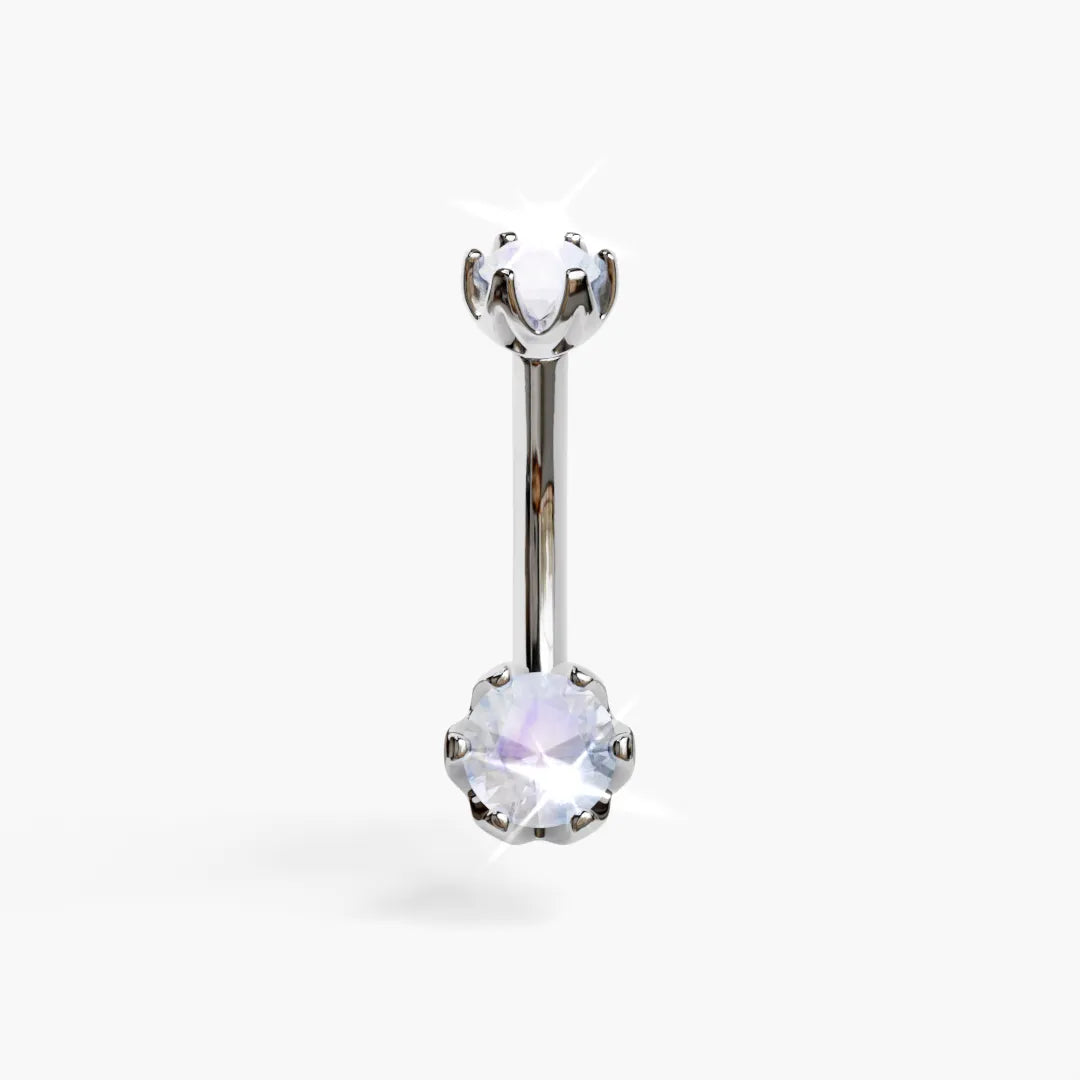 Jolie Co Orchid 5mm Moonstone everyday belly ring in white gold: a milky 5mm round moonstone in orchid-petal prongs below a 4mm top