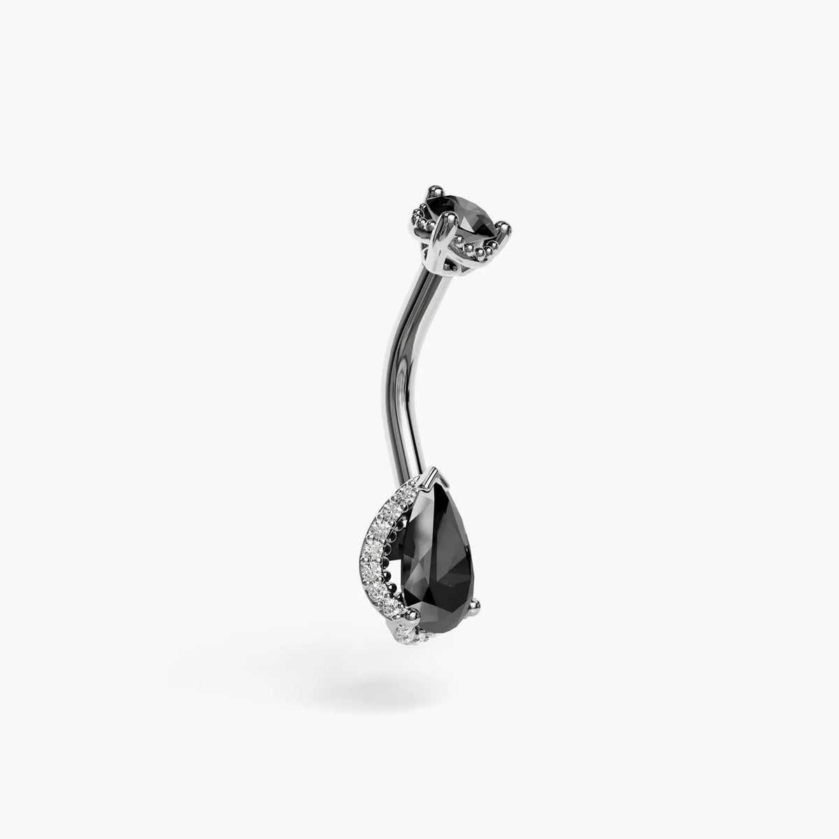 Palladium white gold La Femme Tear Noir from the side, the black onyx pear floating above white pavé